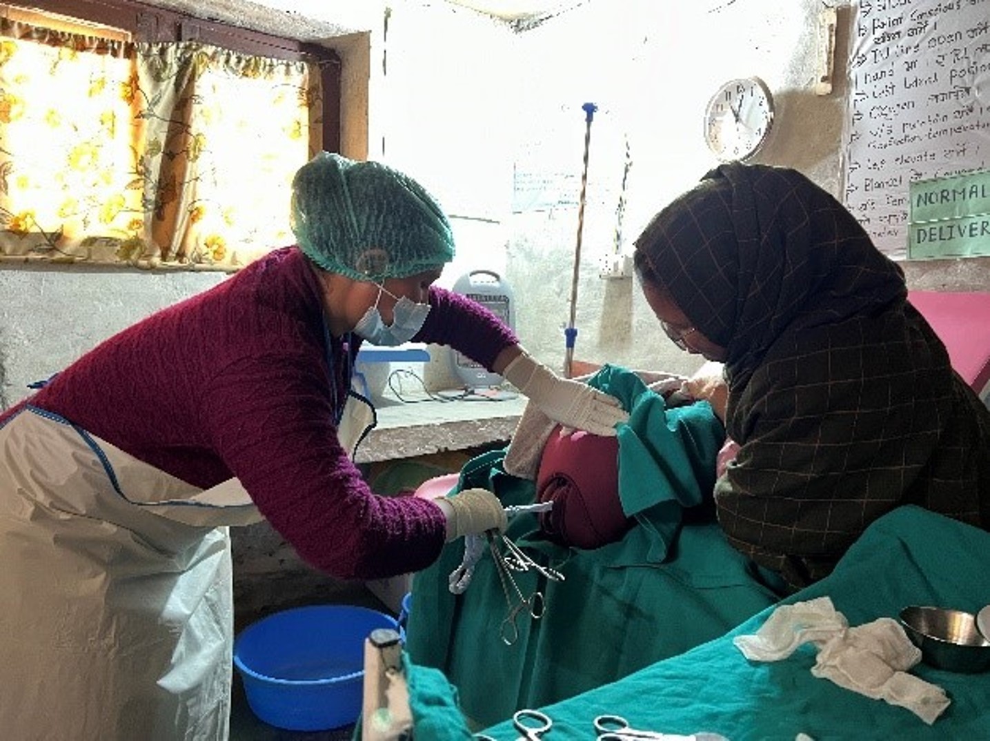 Nurses practice on a Mamma Natalie training device in rural Nepal