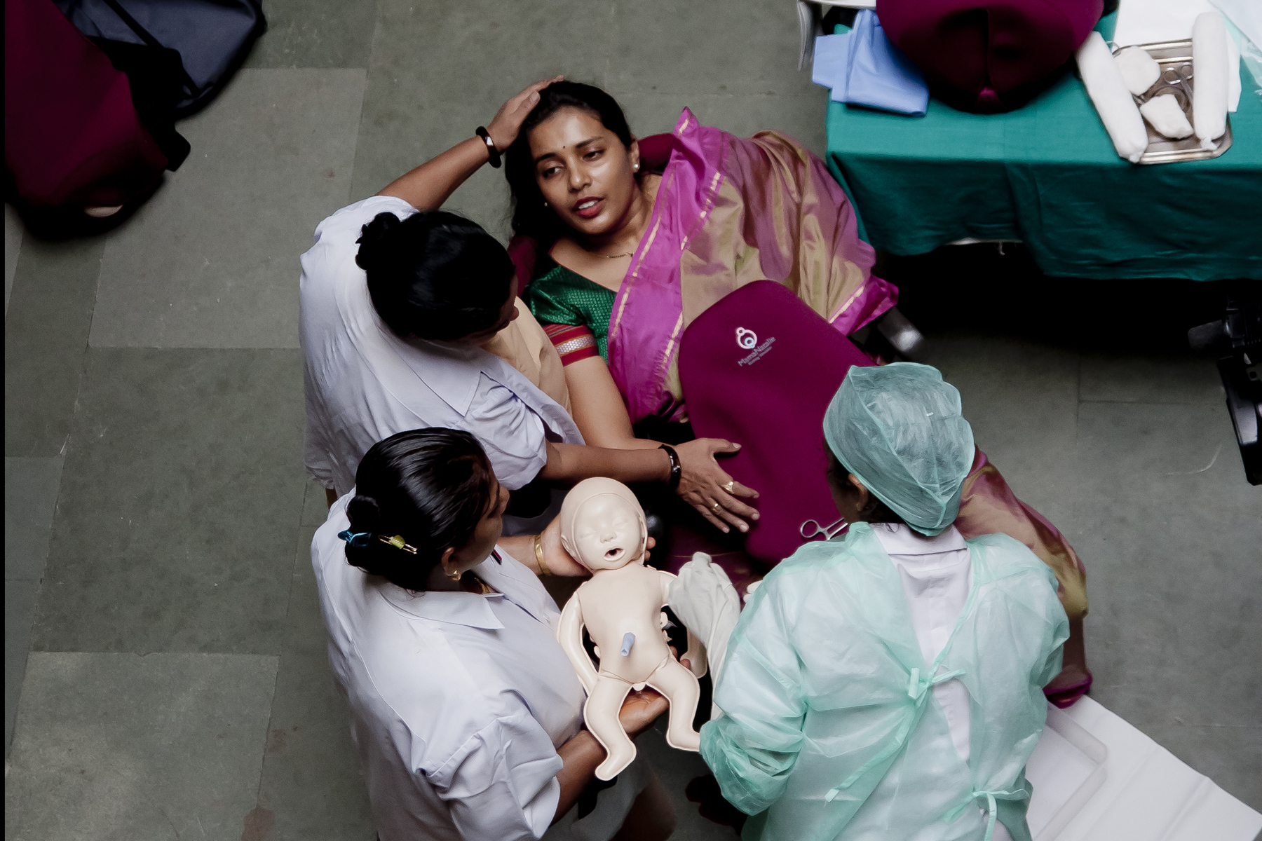 Nurses train on a Laerdal Global Health Mamma Natalie simulator
